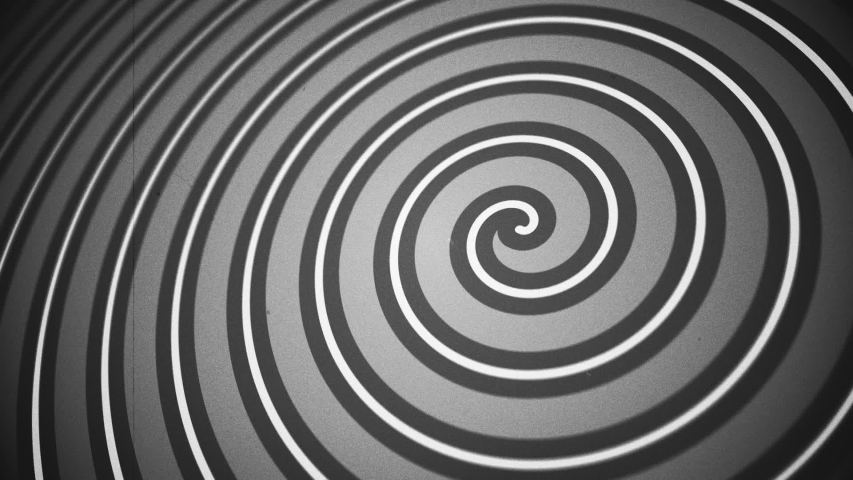 Vintage, hypnotic circus style spiral motion background animation. This black and white Americana styled background is full HD and a seamless loop with added dust and scratches. Royalty-Free Stock Footage #1057243720