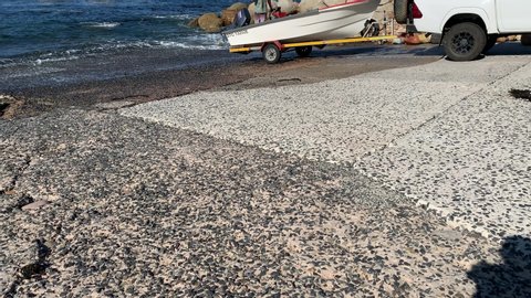 Boat being launched on a slipway at Miller’s Point False Bay coastline on the Cape Peninsula