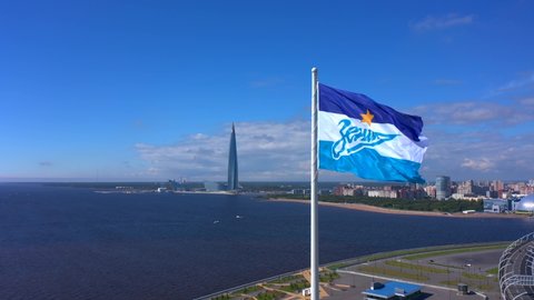SAINT PETERSBURG, RUSSIA - AUGUST 7, 2020: Aerial view of the flag of Zenit - the main football team of St. Petersburg. Drone flight over the city and the skyscraper Lakhta Center.