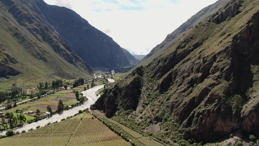 Side aerial view of Ollantaytambo valley, sacred valley of the incas, Peru, 4K