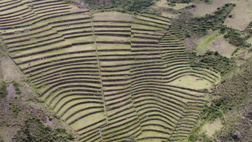 Slow looking downward aerial of Pisac ruins, Sacred Valley of the Incas, Peru, 4K | Shutterstock HD Video #1057281889