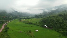 Wonderful aerial view of mountain range with morning fog at Ban Sapan in Nan province, THAILAND. (2.7k video resolution by drone)