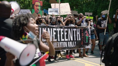 New York, New York / USA - June 2020: BLM Juneteenth Protest footage. People marching from Brooklyn to Harlem. 