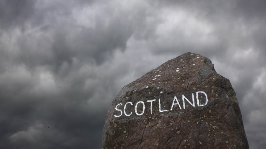 A Sign For Scotland At The Border With England With A Threatening Sky