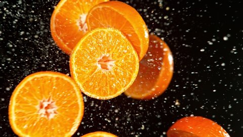 Super Slow Motion Shot of Fresh Tangerines Collision with Splashing Water. Filmed on high speed cinema camera at 1000fps.