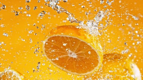 Super Slow Motion Shot of Fresh Oranges Collision with Splashing Water. Filmed on high speed cinema camera at 1000fps.