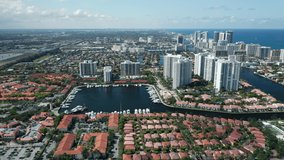 Beautiful Miami suburban city view. Ocean front buildings with Atlantic view on summer day. Cinematic 4K aerial Miami Beach, Florida USA. Urban footage background. Miami vacation travel footage