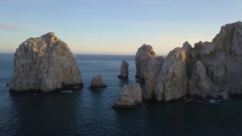 The Arch of Cabo San Lucas, Mexico. Sweeping aerial shot at sunset