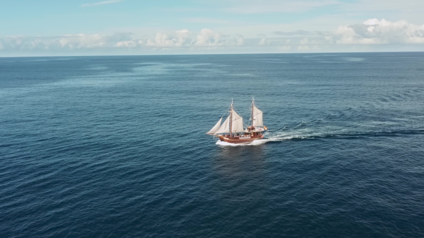 Old pirate ship sailing in the open ocean Royalty-Free Stock Footage #1057303675