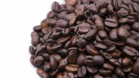 A Pile Of Roasted Coffee Beans Rotating Slowly