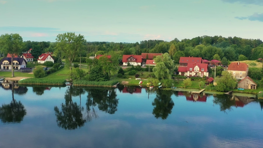 Aerial view of a row of houses by the lake.
