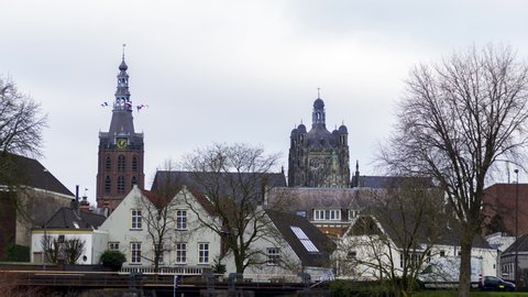 Timelapse of skyline of 's-Hertogenbosch, a city in the Netherlands - zoom in to cathedral towers