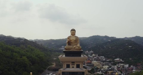 Fo Guang Shan, Aerial pan left in front of large golden Buddha statue in biggest temple in Taiwan, near Kaohsiung