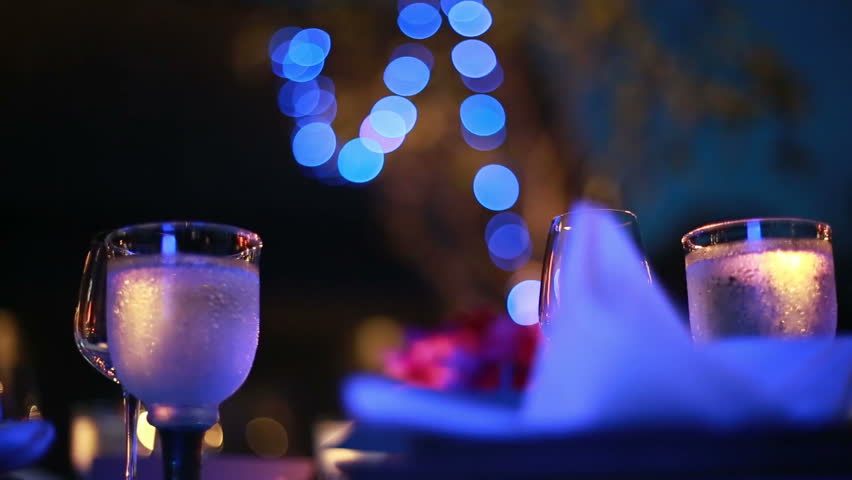 Prepared table with glass and tableware and bokeh for wedding ceremony. Nice decoration and atmosphere. outdoor Royalty-Free Stock Footage #10573247