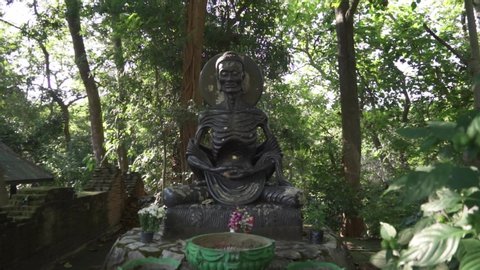 Chiang Mai, Thailand - CIRCA 2020: Skinny Emaciated Fasting Meditating Siddhartha Gautama Buddha Statue - Starving Look with Full Ribs and Veins Showing at Wat Umong Temple