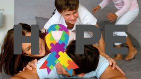 Animation of multi coloured puzzle elements forming ribbon Autism Awareness Month symbol with word Hope over couple with their son and daughter. Autism awareness support concept digital composite. - Powered by Shutterstock - Get 15% off with code: PIKWIZARD15
