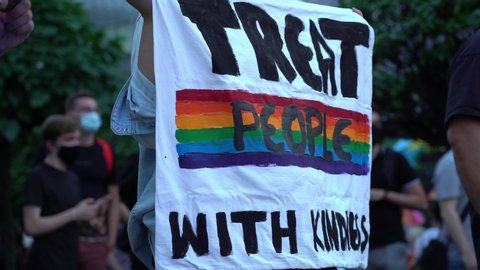 LGBT equality march. Fight for LGBTQ+ rights. Rainbow flags, banners and masks. Struggle for LGBT rights during coronavirus pandemic.