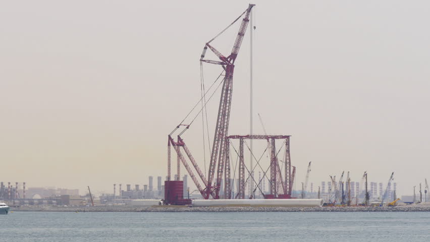 dubai city day time sea red construction crane 4k uae