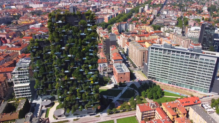 Milan Italy 10 August 2020: Vertical Forest is New Architecture in the new business center of Milan on Porta Nuova promenade. Office buildings. Drone shooting. Modern houses. Lombardy. finance. Bosco | Shutterstock HD Video #1057346710
