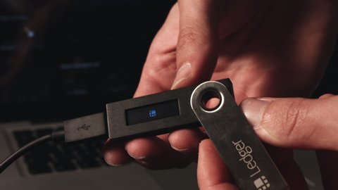 SLOVENIA - 16.6.2020: Ledger hardware wallet for storing cryptocurrency like bitcoin, ethereum and others
