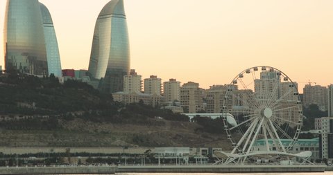 Baku / Azerbaijan - 08-12-2020: Baku city, Caspian sea view with Flame Towers, Ferris Wheel
