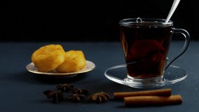 Cup of black tea with lemon slice black wooden table in hd VIDEO. Warm drink infusion for cold fall and winter days. Concept of prevention for flu cold with Vitamin C
