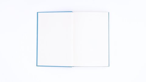 6k Blue book appear and open on white theme. Stop motion 