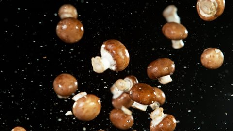 Super slow motion of champignons mushrooms flying up in the air. Filmed on high speed cinema camera, 1000 fps.