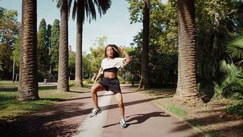 Black woman dancer in park, african american woman dancing hip-hop, outdoor training dance, happy student girl, palms alley, latin contemporary moves, social media blogger