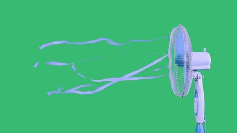 Side view of an electric fan with blue ribbons turning on,ventilating the space,eliminating the swelter,helping to avoid heatstroke.Studio shot on green background.Global warming,technology concept.