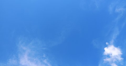 Cirrus Clouds Time Lapse. Thin, wispy strands of clouds floating against the deep blue sky. 4K DCI Time Lapse Video.