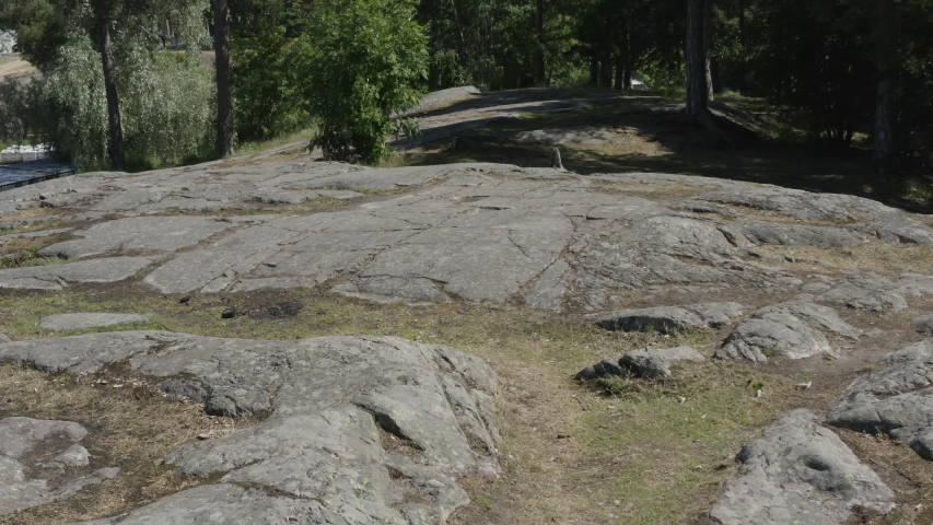 Small rocky hill in a city park.