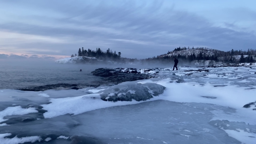 winter time at split rock lighthouse state park in minnesota, lake superior frozen