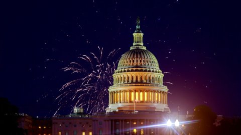 Mysterious night sky with full moon United States Capitol Building in Washington DC with Fireworks Background For 4th of July Independence Day