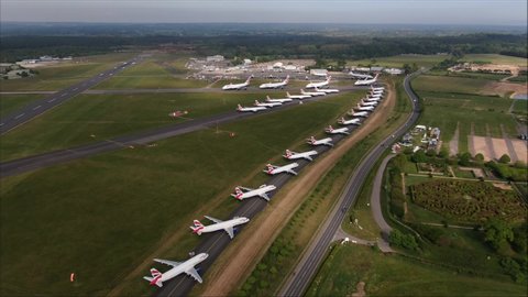 Bournemouth / United Kingdom (UK) - 08 06 2020: Aerial drone shot of British Airways Aircraft Planes parked up on taxiway at Bournemouth Airport. Travel ban and job cuts caused. COVID-19