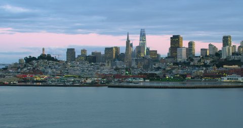 Great aerial view of San Francisco skyscrapers. City skyline and piers. Flyover The Pacific Ocean. California, United States. Shot on Red weapon 8K.
