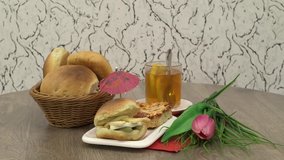 Tasty morning breakfast with bread meat sandwiches tea cup on wooden table background.