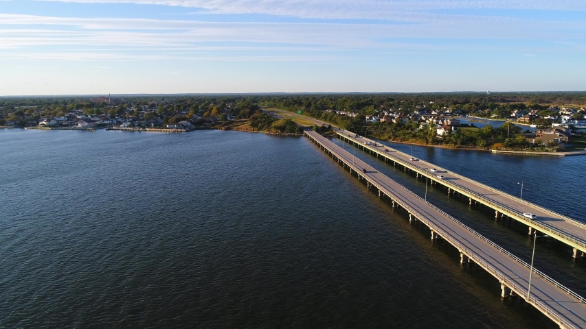 This video shows views aerial views of the Robert Moses Causeway Bridge in Long Island, NY. The Robert Moses Causeway is an 8.10-mile-long parkway in Suffolk County, New York, in the United States. Th | Shutterstock HD Video #1057394914
