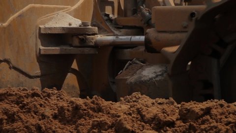 Bulldozer Driving Through the mud at a construction site