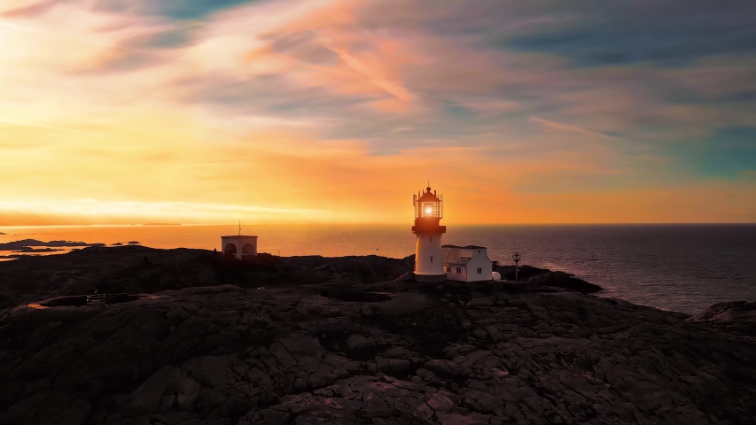 Coastal lighthouse. Lindesnes Lighthouse is a coastal lighthouse at the southernmost tip of Norway. The light comes from a first order Fresnel lens that can be seen for up to 17 nautical miles | Shutterstock HD Video #1057403758