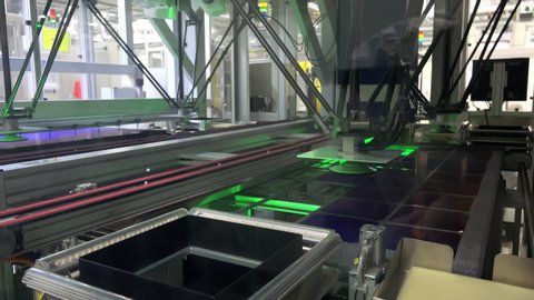  Robotic Arm Puts Solar Cells On The Conveyor Belt In A Photovoltaic Factory