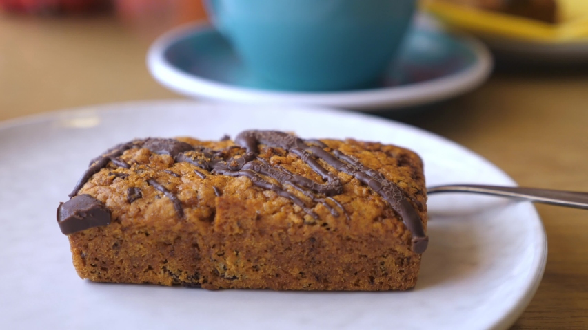 Hands breaking healthy organic vegan bar in half.