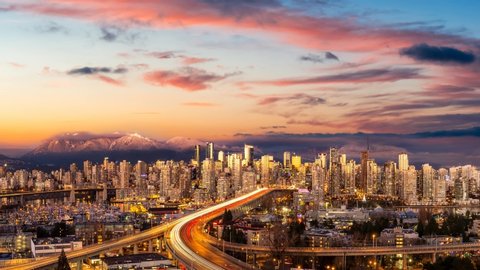 Cinemagraph Continuous Loop Animation. Aerial Panoramic view of Downtown Vancouver, Cambie Bridge, and False Creek. Picture taken during a cloudy sunset. Colorful sky Overlay.