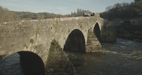 Viiew of Ponte Maceira stone bridge from 18th century on winter time. Camino de Santiago footpath
