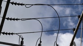 Electrical wire and structural isolated on blue sky and white cloud closeup moving naturally. 