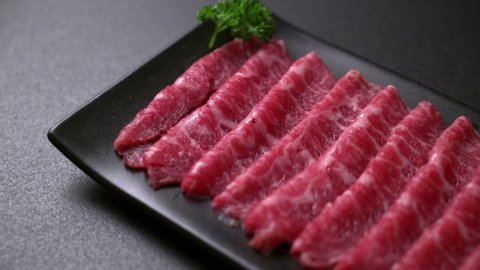 fresh beef raw sliced with marbled texture served for Sukiyaki and Shabu or Yakiniku