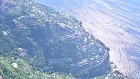 Aerial Shot of the Amalfi Coast in Positano, Italy. The concept of a summer vacation in the best places in Europe. 4K video. Panorama of the sea and yachts (boats) on the water.