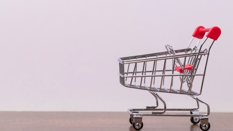 4k stop motion close-up of a shopping trolley, cart from the supermarket.: film stockowy