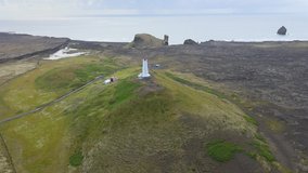 Flying around a lighthouse in Icelandic south coast