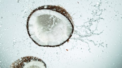 Super Slow Motion Shot of Water Splashing From Coconut Collision